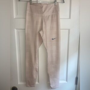 Nike workout leggings, size small, white and tan plaid with bluish nike swoop